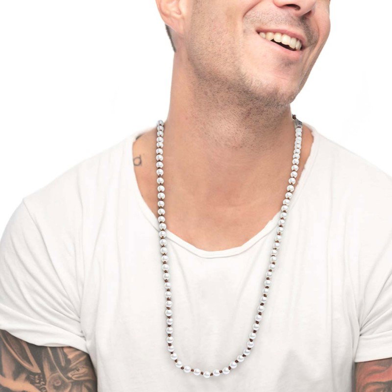 S.STEEL NECKLACE 600MM ROPE WITH PEARLS S.steel necklace with brown cotton rope 0,80 mm diameter with pearls 6,20 mm diameter. A