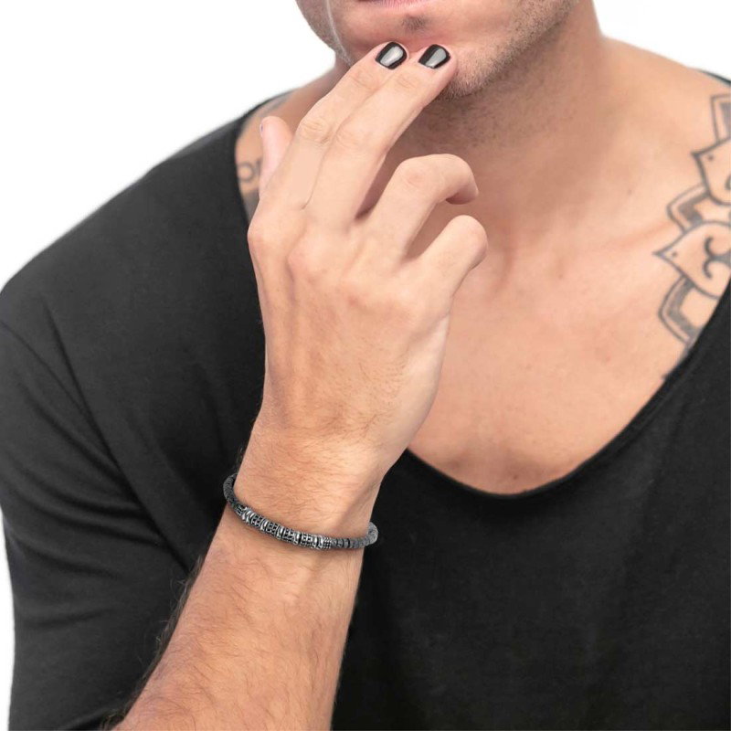 S.STEEL BR WITH LAVA STONE BEADS S.steel bracelet with lava stone beads 2,30*4,30 mm on the sides. In the center alternated poli