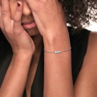 S.STEEL BR WITH 3 WHITE CZ STONE 3 MM S.steel bracelet with cutting cross chain 1,20 mm width, 0,26 mm thickness. On the center