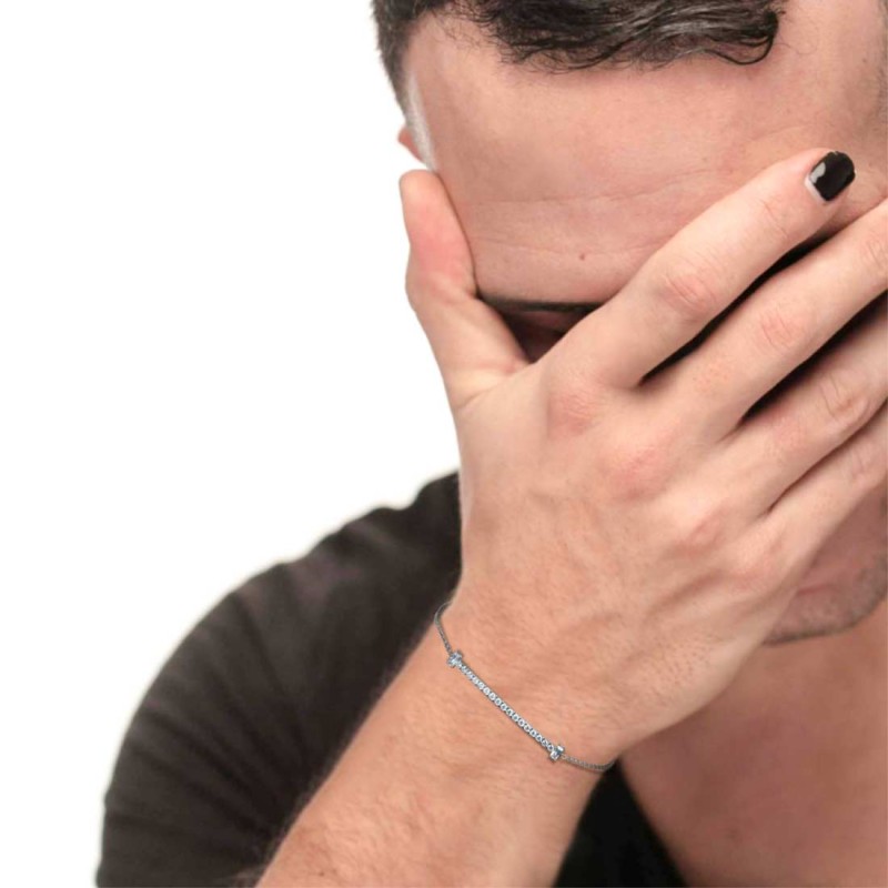 S.STEEL BR WITH WHITE CZ STONE AND BAGUETTE S.steel bracelet with cutting cross chain, 1,20 mm width, 0,26 mm thickness. On the