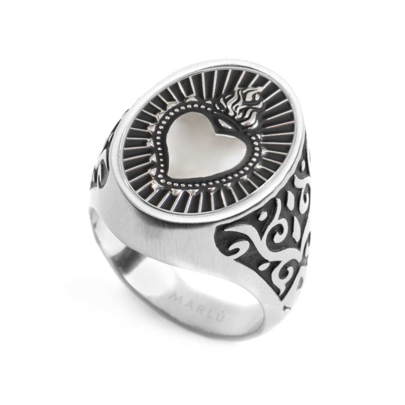 S.STEEL OVAL PLATE WITH SACRED HEART Polished s.steel oval plate 15,30*20 mm, 3 mm thickness, with mat black oil. On the front s