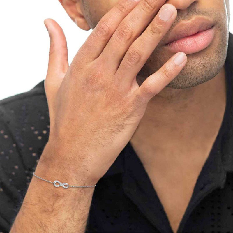 S.STEEL BR WITH INFINITY WITH CZ STONE S.steel bracelet with cutting cross chain, 1,20 mm width, 0,26 mm thickness. On the cente