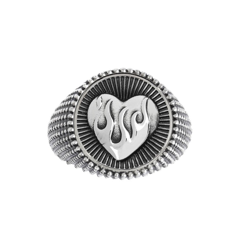 S.STEEL ROUND PLATE WITH HEART WITH FLAMES Polished s.steel round plate by casting 16,10 mm diameter, 1 mm thickness. On the fro