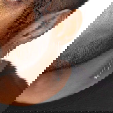 Orecchino pendente catena a sfere con stella