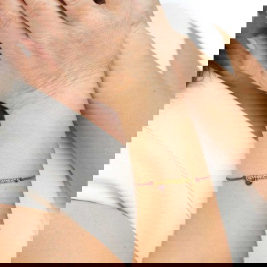 Bracciale cordino con elementi acciaio e zircone pendente